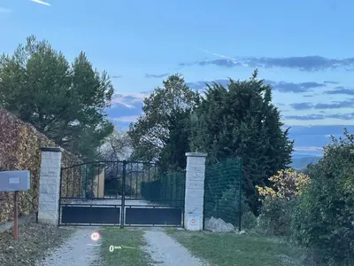 an entrance to a gate with a fence at Magnifique villa -piscine privée vue Mont Ventoux in Malemort-du-Comtat