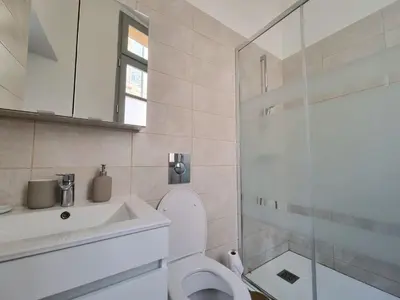 a bathroom with a toilet and a sink and a shower at Studio centre historique 1 in Aix-en-Provence